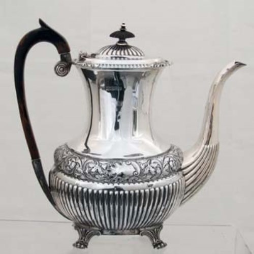 Lot 208 - Embossed silver coffee pot.