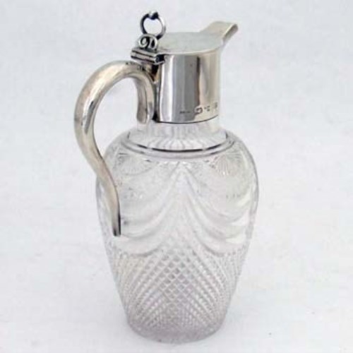 Lot 209 - Cut glass and silver claret jug.
