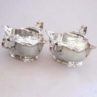 Lot 224 - Pair of George III style silver double-ended