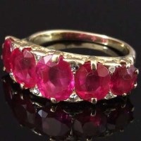 Lot 252 - Five stone ruby ring.