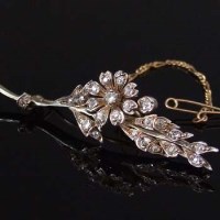 Lot 253 - Edwardian gold and diamond floral spray brooch.