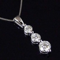Lot 261 - 18ct white gold and diamond three-stone pendant