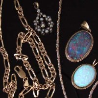 Lot 266 - Two gold necklace chains with pendants