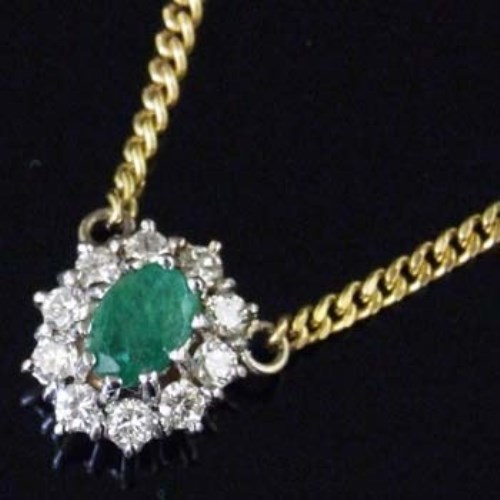 Lot 273 Emerald pendant with 18ct gold chain.