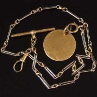 Lot 285 - Bi-coloured watch chain with guinea fob.