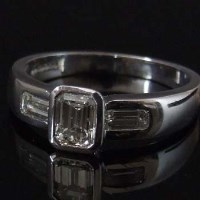 Lot 293 - Emerald-cut diamond single stone ring, on