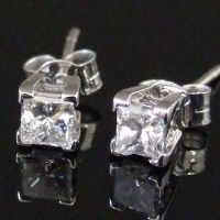 Lot 303 - Pair of 18ct gold diamond ear studs.