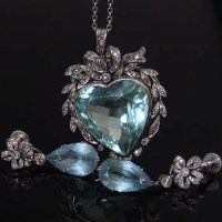 Lot 304 - Aquamarine and diamond heart shaped pendant and a