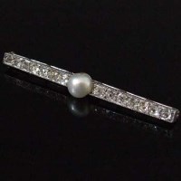 Lot 310 - Platinum pearl and diamond brooch