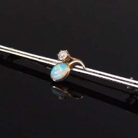 Lot 312 - Opal and diamond bar brooch.
