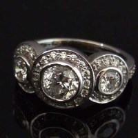 Lot 331 - Three-stone diamond ring.