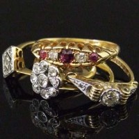 Lot 336 - Ruby and diamond 18ct gold ring; three diamond