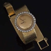Lot 359 - Lady's Omega watch 18ct gold diamond surround.