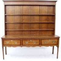 Lot 640 - George III oak and mahogany cross banded dresser.