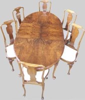 Lot 682 - Walnut wind-out table, winder, 2 leave and 6 dining chairs.