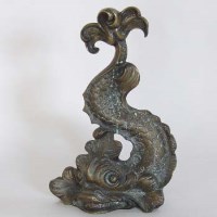Lot 24 - Door stop in the form of a dolphin.