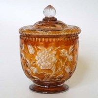 Lot 57 - Amber flash glass jar and cover.