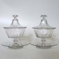 Lot 65 - Pair of glass lidded dishes and stands