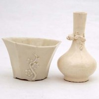 Lot 70 - Libation cup, a vase and two wood stand.