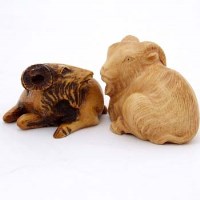 Lot 82 - Two netsuke in the form of goats (2).