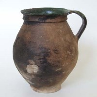 Lot 104 - Early pottery jug possibly Medieval