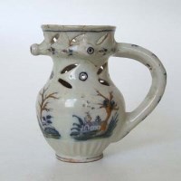 Lot 107 - Tin glazed puzzle jug