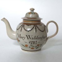 Lot 124 - Pearlware teapot named Mary Waddington.