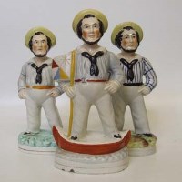 Lot 158 - Three Staffordshire figures of sailors