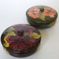 Lot 204 - Two Moorcroft Hisbiscus lidded bowls.