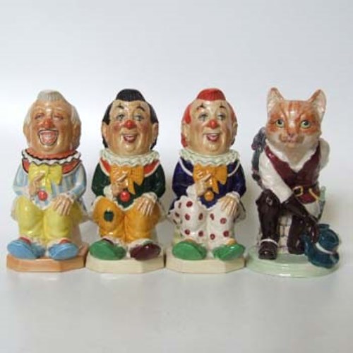 Lot 239 - Three Kevin Francis clowns and puss in boots.