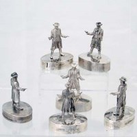 Lot 263 - Six cast silver figures of a gunslinger with two