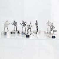 Lot 264 - Six cast silver figures of a gunslinger; another