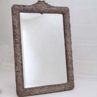 Lot 275 - Dressing table mirror with embossed white metal