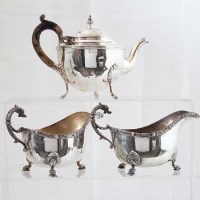 Lot 303 - Silver teapot and a pair of sauceboats.