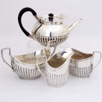 Lot 317 - Small teapot; two milk jugs; sugar basin (4).