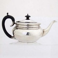 Lot 321 - Silver compressed globular teapot.