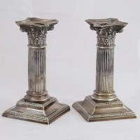 Lot 322 - Pair silver squat Corinthian column candlesticks.
