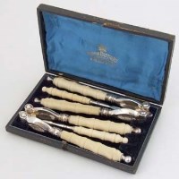 Lot 209 - Cased Victorian E.P. ivory nut crackers.