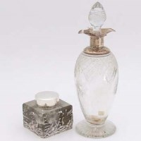 Lot 210 - Silver topped decanter and an inkwell.