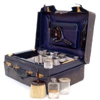 Lot 221 - Silver and blue leather travelling case.