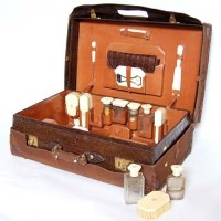 Lot 223 - Travelling case with ivory topped fittings.
