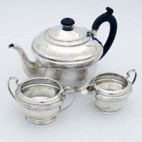 Lot 245 - Silver three piece tea set.