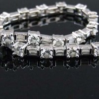 Lot 305 - 18ct white gold and diamond line bracelet