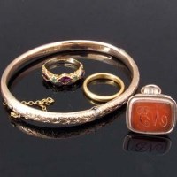 Lot 327 - Two rings, bangle and a seal fob.