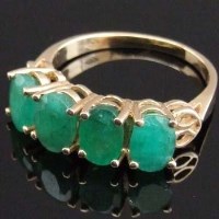 Lot 338 - Emerald four stone ring