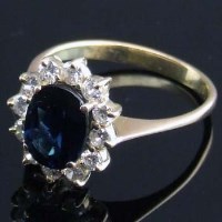 Lot 344 - Sapphire and diamond cluster ring