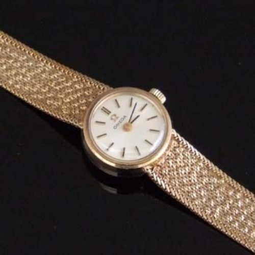 Lot 363 - Lady's 9ct gold Omega bracelet watch