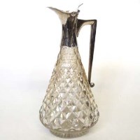 Lot 231 - Silver mounted cut glass claret jug