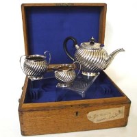 Lot 236 - Oak cased silver three-piece tea set, 17oz 10dwt