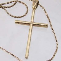 Lot 262 - 18ct gold cross, 8.2g. on 9ct trace chain